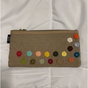 Flowers, zipper, jute bag. Originally bought from
www.EternalThreads.org